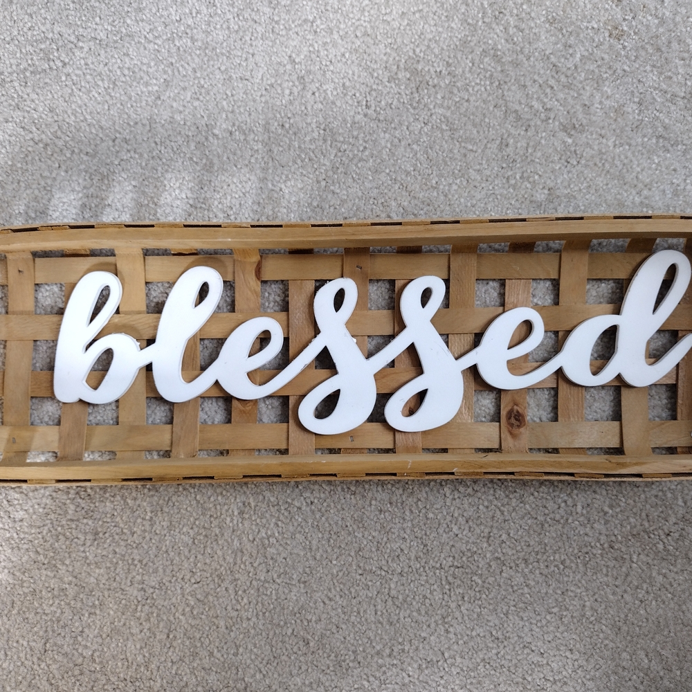 White 'Blessed' Sign on Tan Woven Basket